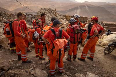 Members of a British rescue team gather in the earthquake-hit village of Douzrou in the Atlas Mountains of central Morocco, on September 12. AFP