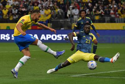 Brazil's Cunha and Colombia's Davinson Sanchez vie for the ball. AFP