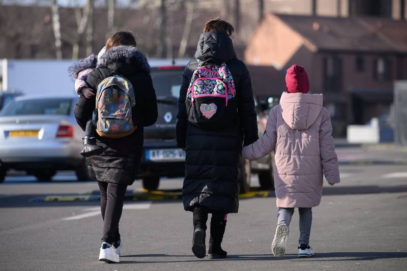 A group of refugees from Ukraine leaves a budget hotel in Tourcoing, France, where Britain has a visa processing centre. Getty Images