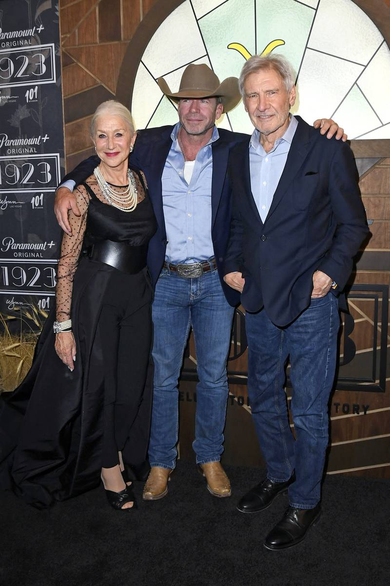 LAS VEGAS, NEVADA - DECEMBER 03: (L-R) Helen Mirren, Taylor Sheridan, and Harrison Ford attend Paramount+'s "1923" Las Vegas Premiere at the Encore Theater at Wynn Las Vegas on December 03, 2022 in Las Vegas, Nevada.    Mindy Small / Getty Images / AFP (Photo by Mindy Small  /  GETTY IMAGES NORTH AMERICA  /  Getty Images via AFP)