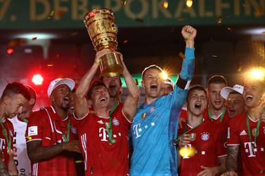 Robert Lewandowski lifts the German Cup after victory over Bayer Leverkusen completed the double for Bayern Munich. Getty