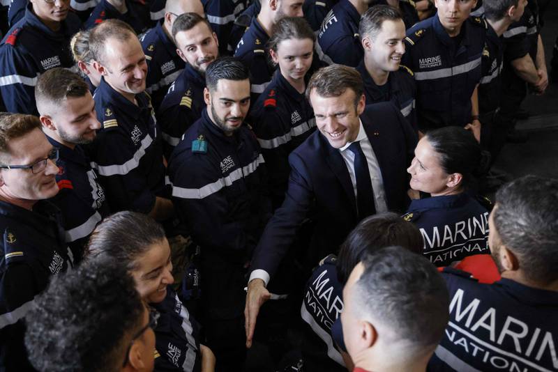 He greets members of the French navy