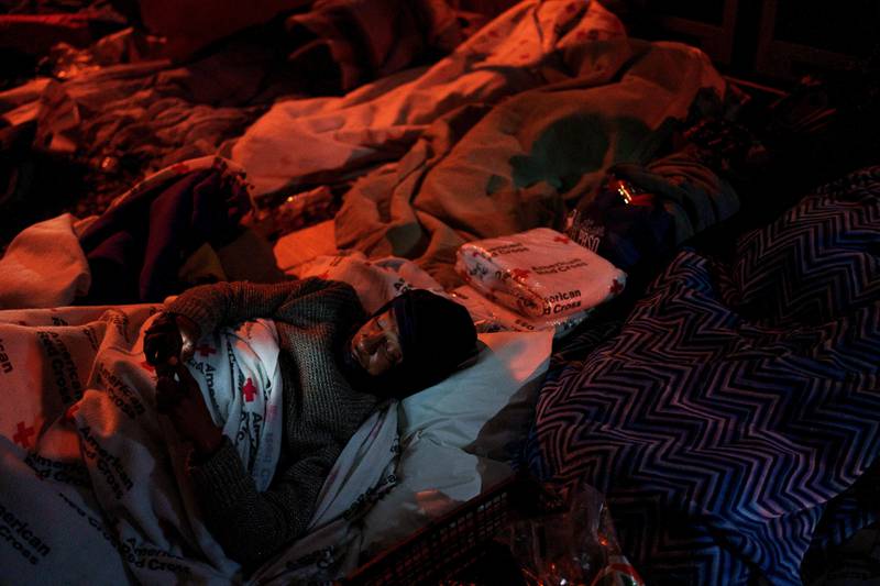 Venezuelans seeking US asylum rest under Red Cross blankets outside of Sacred Heart Church in El Paso's city centre. Reuters