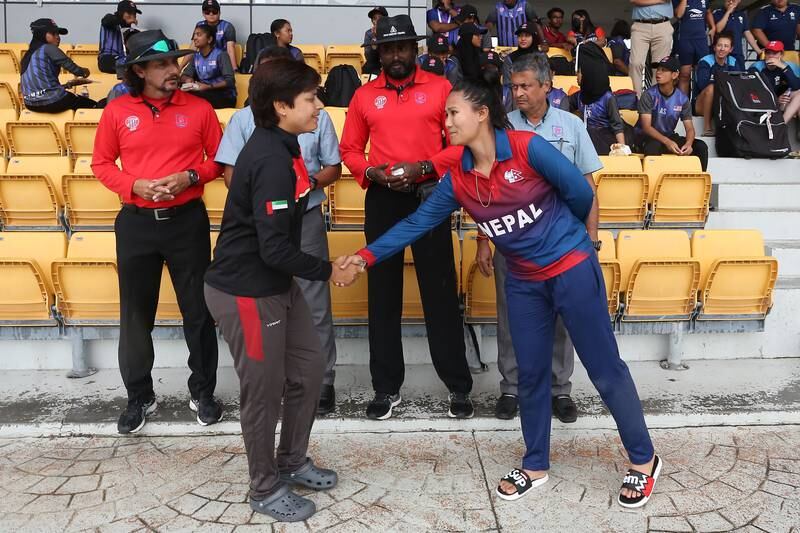 UAE captain Chaya Mughal shakes hand with Nepal's Rubina Chhetry after the semi-final was abandoned in Kuala Lumpur. Courtesy Malaysia Cricket Association