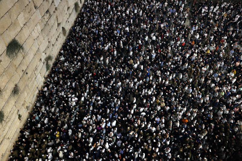 Jews participate in the Slichot (forgiveness) prayer at the Western Wall in the Old City of Jerusalem, before the Day of Atonement, or Yom Kippur, the most sacred day of the Jewish calendar which will begin in the evening of October 4. AFP