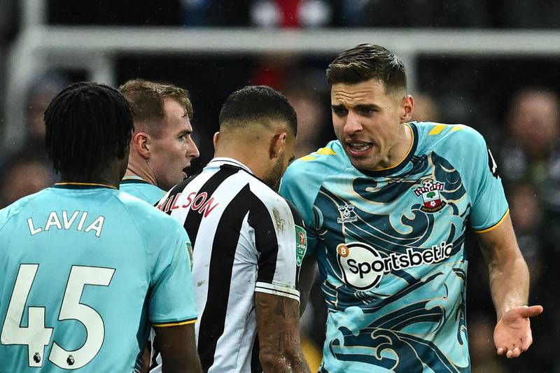 Newcastle striker Callum Wilson argues with Southampton's Polish defender Jan Bednarek. AFP