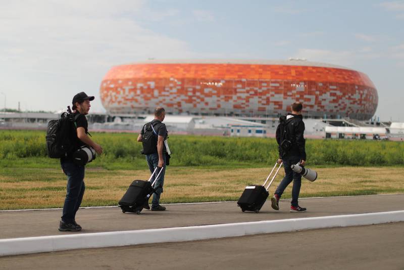 Reuters photographers, from left to right, Ivan Alvarado, Murad Sezer, and Matt Childs walk to the World Cup stadium in Saransk, Russia. Lucy Nicholson / Reuters