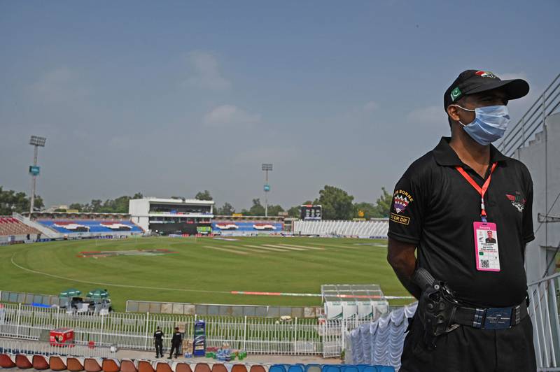 A policeman stands guard on the empty stands of the Rawalpindi Cricket Stadium on Friday, September 17, 2021.  New Zealand abandoned the tour of Pakistan over security concerns. AFP