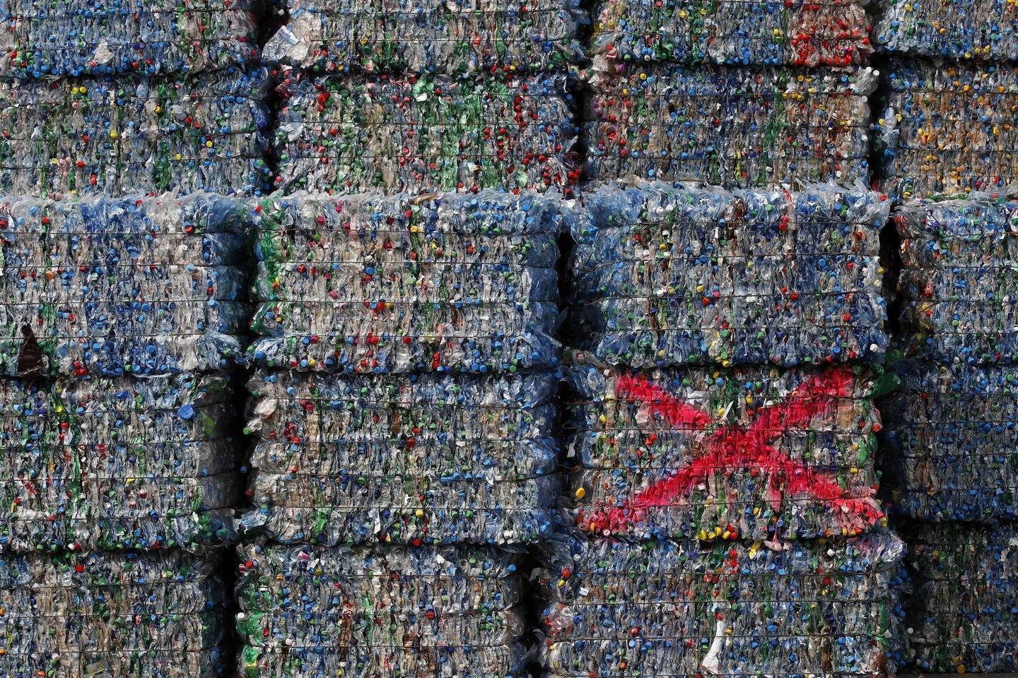 Crushed plastic bottles and containers sit bound in a bale ready to be recycled at the new Poly Recycling AG facility in Bilten, Switzerland, on Wednesday, April 3, 2019. The economics of plastic recycling  have suddenly been upended, thanks to a Chinese import ban and cheap U.S. oil used to make virgin plastic. Photographer: Stefan Wermuth/Bloomberg