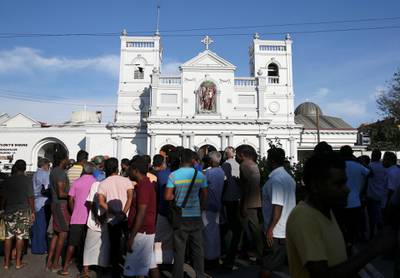 Locals stand in front of St Anthony's shrine in Colombo, after bomb blasts ripped through churches and luxury hotels on Easter, in Sri Lanka. Reuters