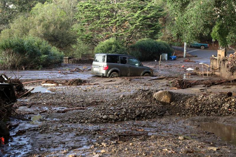 A car is trapped in mud following heavy rains in Montecito. EPA