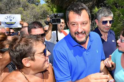 Italy's Interior minister and deputy Prime Minister Matteo Salvini looks on as he surrounded by supporters during his electoral tour "Italian Summer Tour", in Policoro, South of Italy, on August 10, 2019. Salvini was pulling out all the stops on August 10, 2019 to rally supporters for a snap election after he withdrew his League party from an increasingly acrimonious coalition government, plunging the country into turmoil. / AFP / Alberto PIZZOLI
