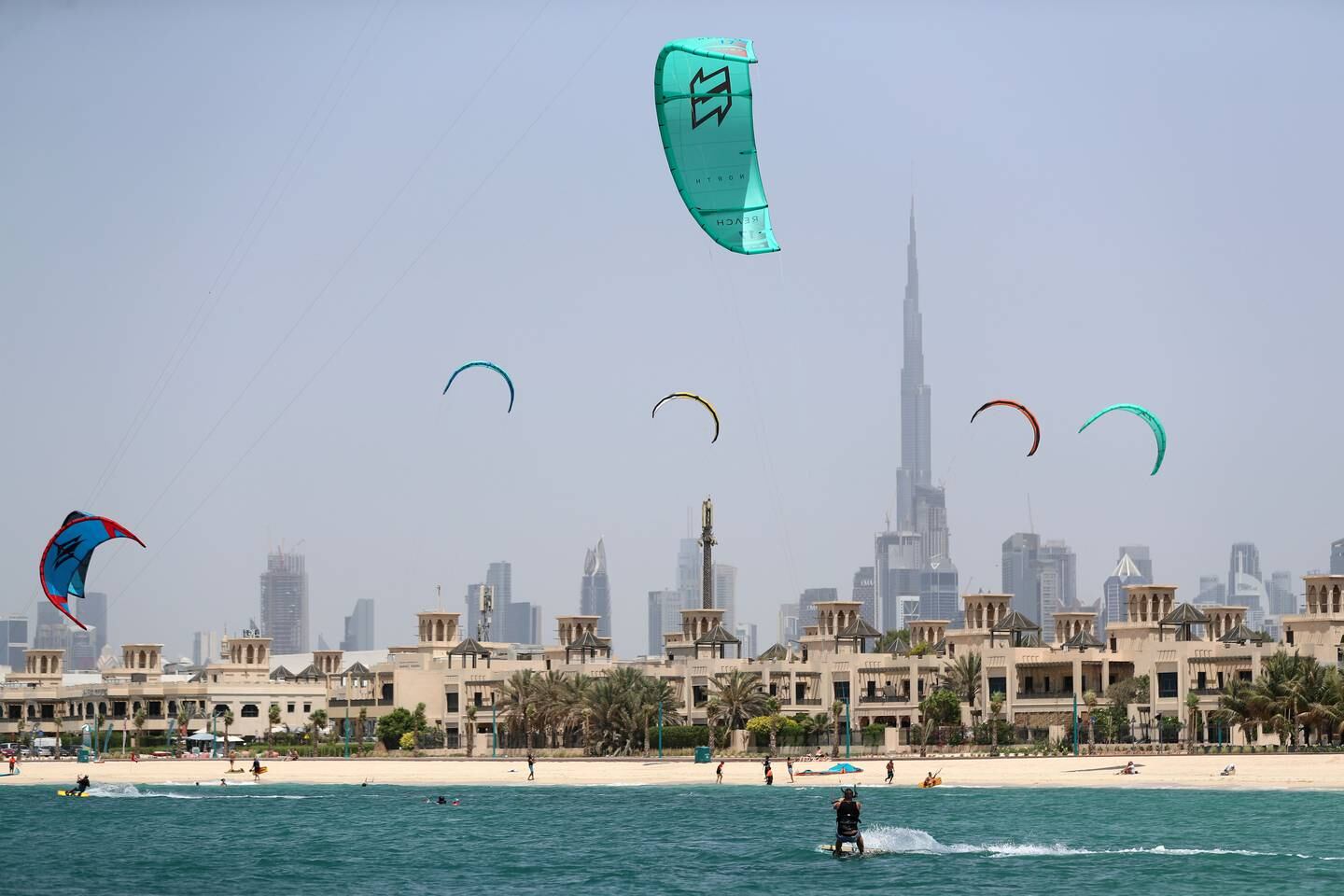 Kitesurfers take to the water off Kite Beach in Dubai. Chris Whiteoak / The National