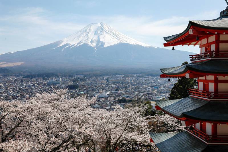 epa08429124 (FILE) Japan's highest peak Mount Fuji, 3,776.24m, is seen over cherry blossoms in full bloom and a memorial pagoda for war dead at Arakurayama Sengen Park in Fujiyoshida, Yamanashi Prefecture, central Japan, 16 April 2019 (reissued 18 May 2020). According to media reports on 18 May 2020, Mount Fuji will be closed to tourists and climbers this summer amid the COVID-19 coronavirus pandemic.  EPA-EFE/KIMIMASA MAYAMA *** Local Caption *** 56093360