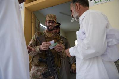A Pakistani soldier checks a voters information in Islamabad. AFP