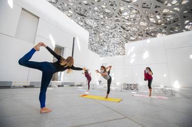 Take a yoga class under Louvre Abu Dhabi's stunning roof. Courtesy Louvre Abu Dhabi