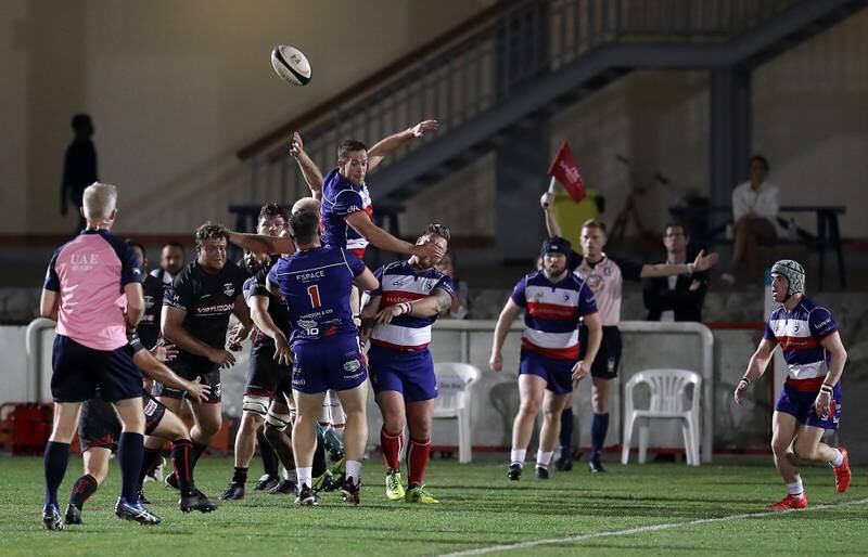 Action from the match between Dubai Exiles and Jebel Ali Dragons. Pawan Singh / The National   