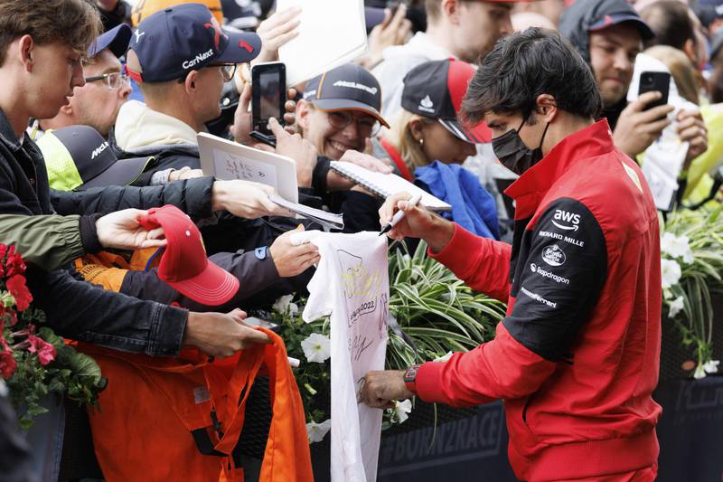 Ferrari driver Carlos Sainz Jr signs autographs at the Styrian Green Carpet near the Red Bull Ring. AFP