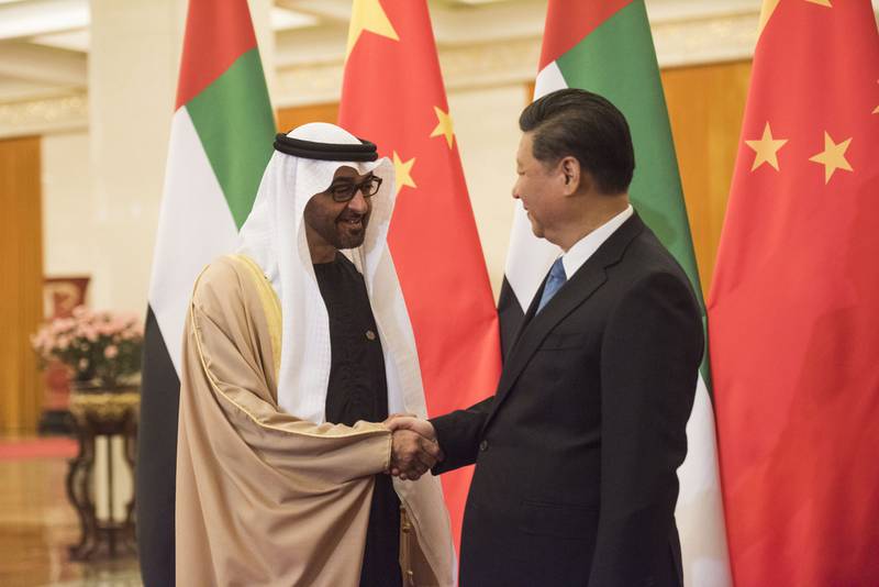 Sheikh Mohammed bin Zayed, Crown Prince of Abu Dhabi and Deputy Supreme Commander of the Armed Forces, shakes hands with Chinese president Xi Jinping at the Great Hall of the People in Beijing on December 14, 2015.  AFP

