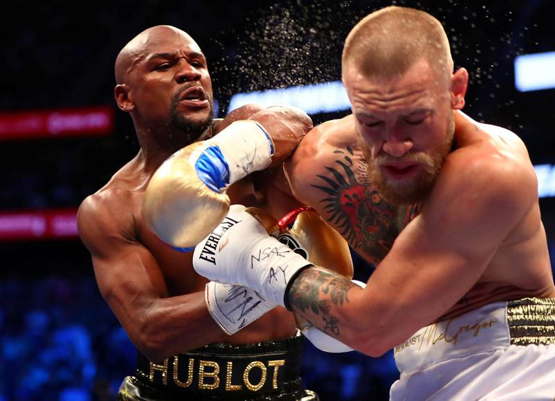 FILE PHOTO: Aug 26, 2017; Las Vegas, NV, USA; Floyd Mayweather Jr. lands a hit against Conor McGregor during their boxing match at the at T-Mobile Arena. Mandatory Credit: Mark J. Rebilas-USA TODAY Sports/File Photo