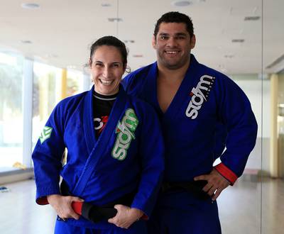 Over the past two years, Caroline de Lazzer, left, married fellow jiu-jitsu practitioner Marcos Oliveira and had a baby boy. They are back competing again. Ravindranath K / The National

