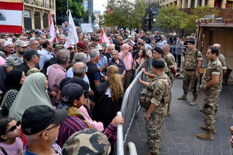 Retired officers and soldiers at a protest against the approval of the 2022 budget in Beirut. EPA
