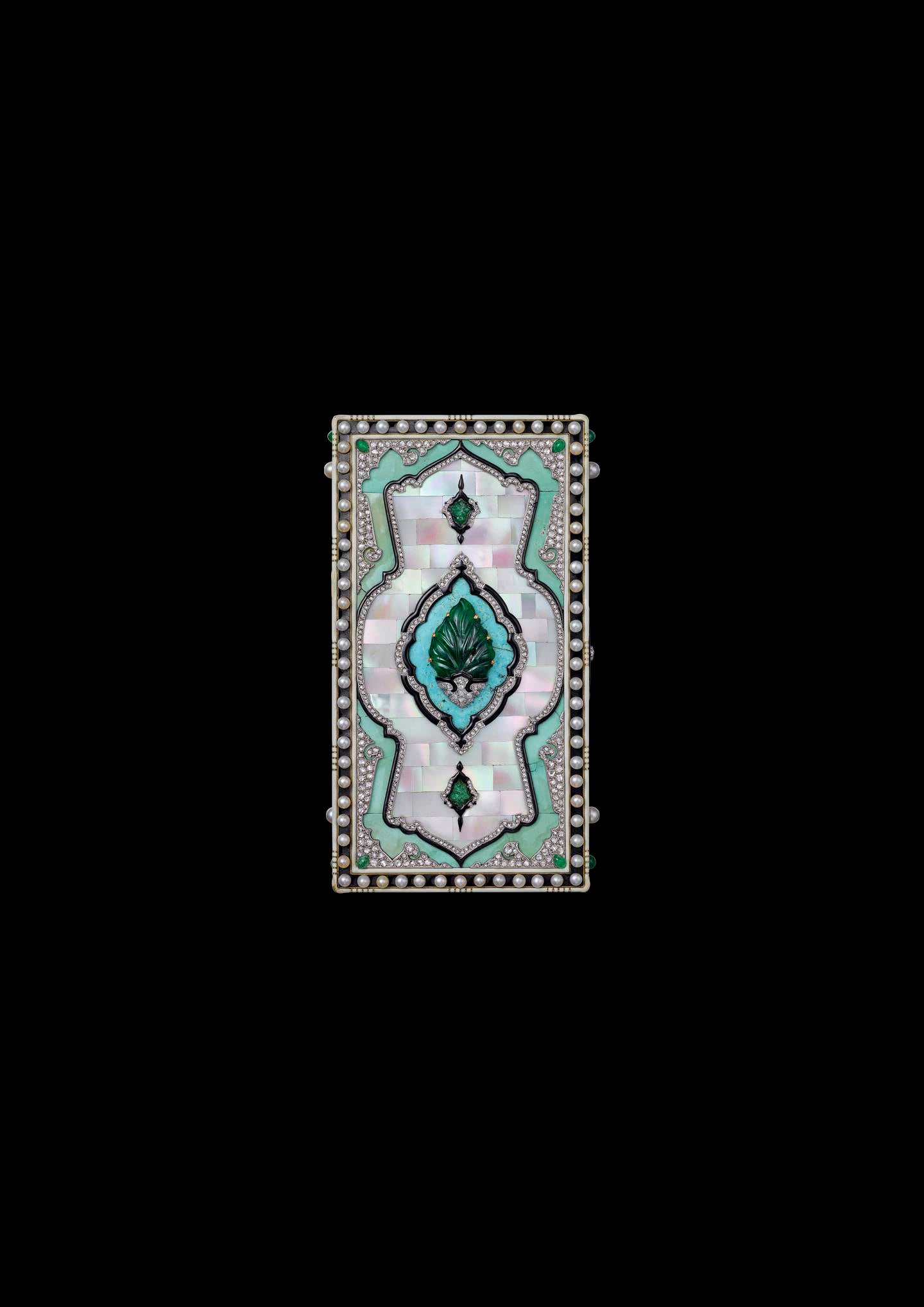 This Cartier vanity case is made with gold, platinum, parquetry of mother-of-pearl and turquoise, emeralds, pearls, diamonds, and black and cream enamel. Photo: Cartier Collection 