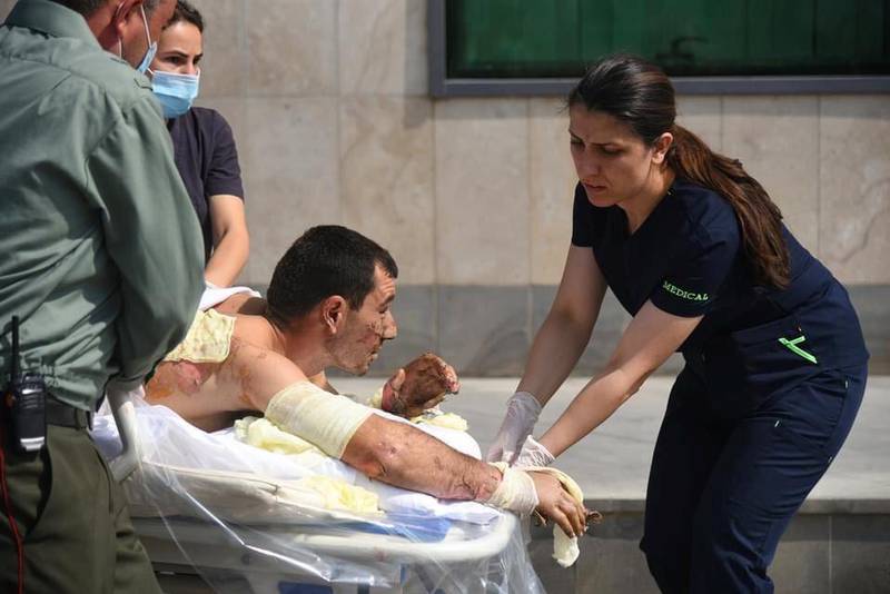 A handout photo released by the Armenian Foreign Ministry shows specialists delivering medical support to a man, who is said to be a civilian injured during clashes in the breakaway region of Nagorno-Karabakh. REUTERS