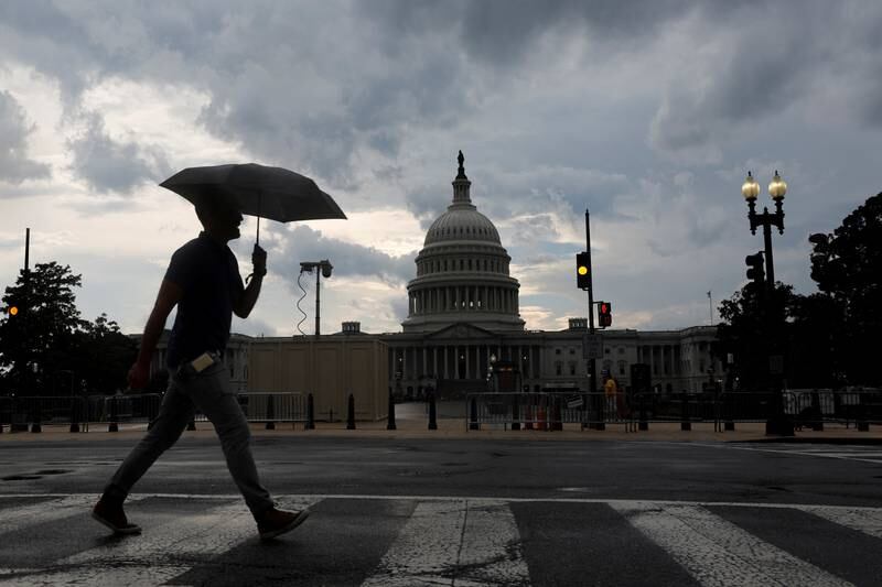 Storm clouds pass over the US Capitol in Washington.  US inflation is at a four-decade high. Reuters