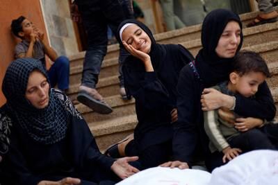 People mourn outside a hospital in Khan Younis following Israeli strikes in Gaza Strip earlier this week. Reuters
