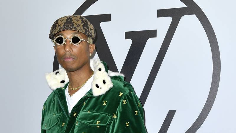 Pharrell Williams walks in the Chanel show in Paris