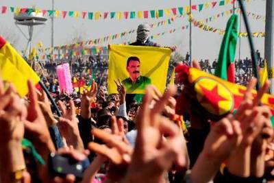 Kurds celebrate Nowruz, the Persian New Year festival, and flash victory signs in the southern Turkish city of Diyarbakir yesterday.