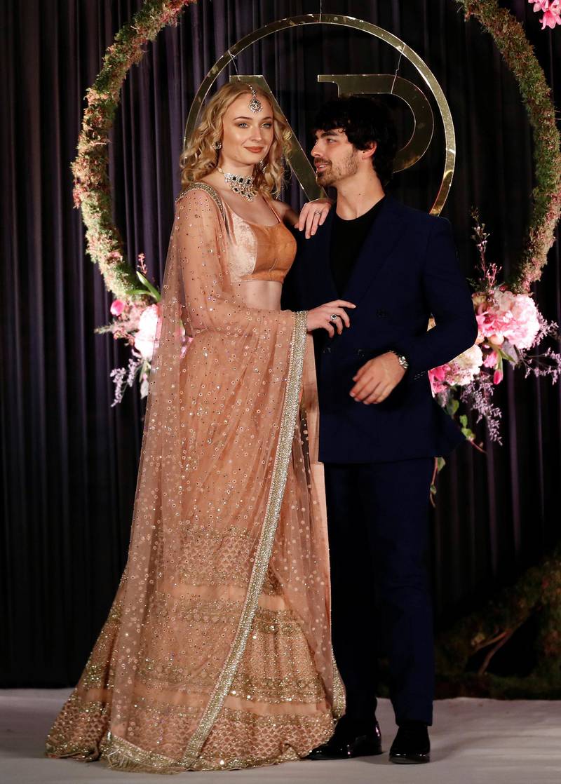 Sophie Turner and Joe Jonas pose during a photo opportunity at the wedding reception of Bollywood actor Priyanka Chopra and singer Nick Jonas, in New Delhi. Photo: Reuters