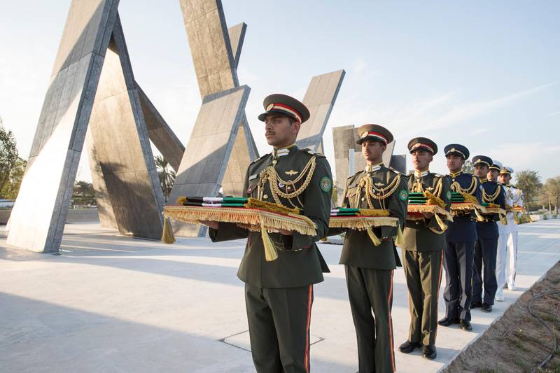 Members of the Armed Forces take part in a presentation for Commemoration Day at Wahat Al Karama, the monument in Abu Dhabi that honours those who have died while serving the country. Ryan Carter / Crown Prince Court - Abu Dhabi