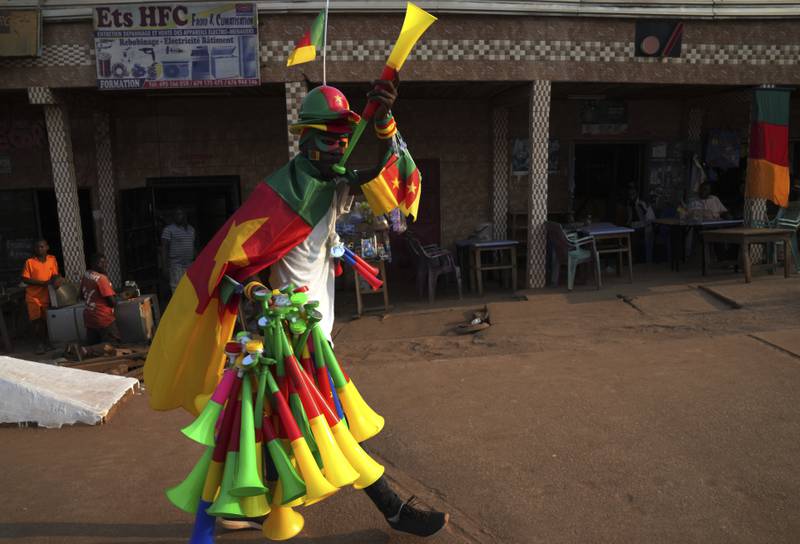 A street vendor sells Cameroonian flags and paraphernalia near Olembe Stadium in Yaounde, Cameroon, ahead of the African Cup of Nations. AP