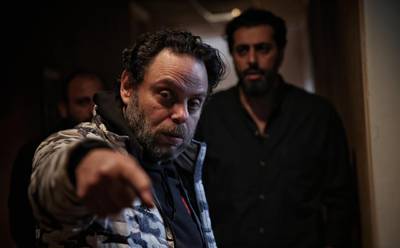 Director Seif Sbei, centre, instructs actor Bassem Yakhour during a scene of 'On a Hot Plate'. Courtesy Ahmad al-Harek