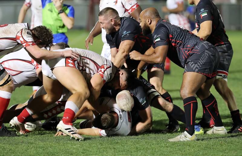 Abu Dhabi Harlequins and Dubai Exiles players battle for the ball during the UAE Premiership final. 