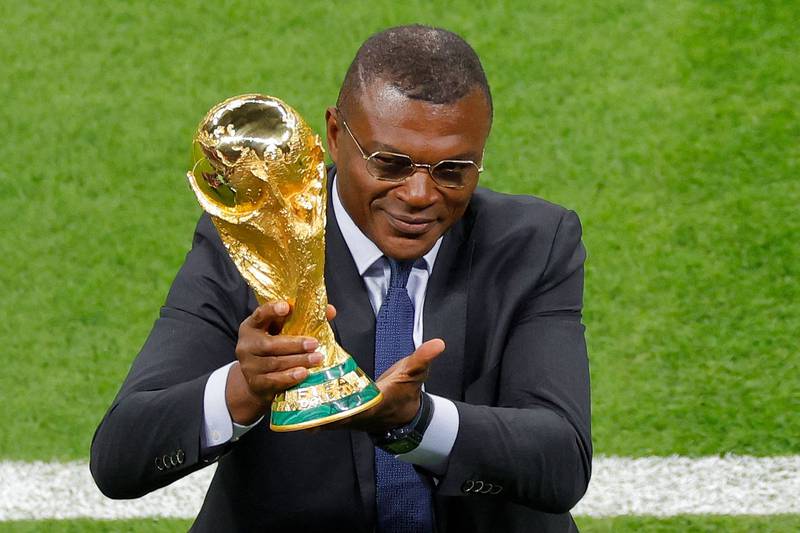 Former footballer Marcel Desailly holds the Fifa World Cup trophy ahead of the opening ceremony. AFP