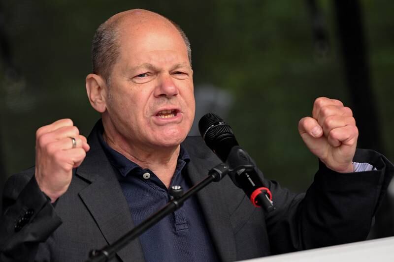 Olaf Scholz shouted over hecklers at an International Workers' Day event on Sunday. EPA