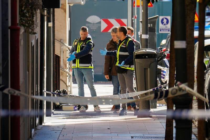 Spanish police inspect the area after former president of the People's Party of Catalonia Alejo Vidal-Quadras, was shot in the face in Madrid. EPA