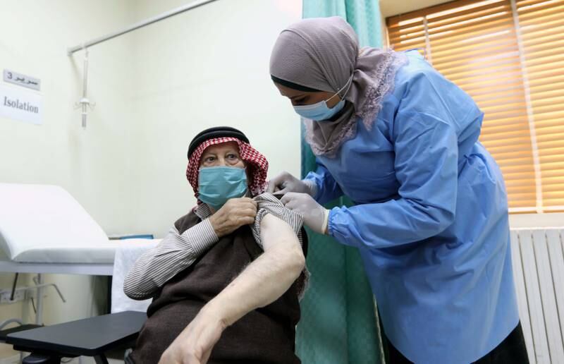 A man receives a dose of Covid-19 vaccine in Amman. Photo: EPA