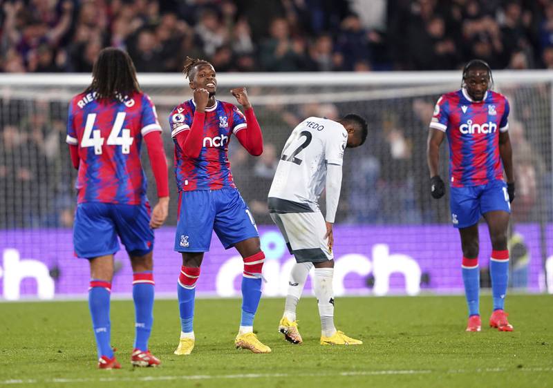 Crystal Palace's Wilfried Zaha, second left, celebrates at the final whistle. AP