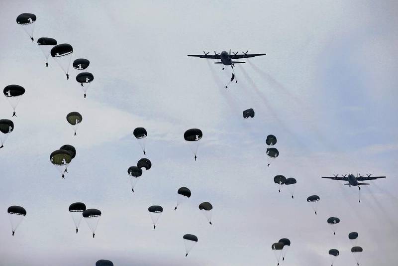 Indonesia soldiers jump from a Hercules C-130 military transport plane during an exercise at Ranai military airbase in Natuna Island, Riau Islands province, Indonesia. Beawiharta / Reuters