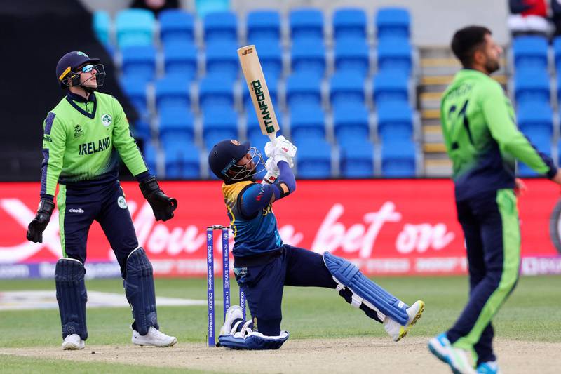 Kusal Mendis plays a shot over the boundary for six to win the match for Sri Lanka. AFP