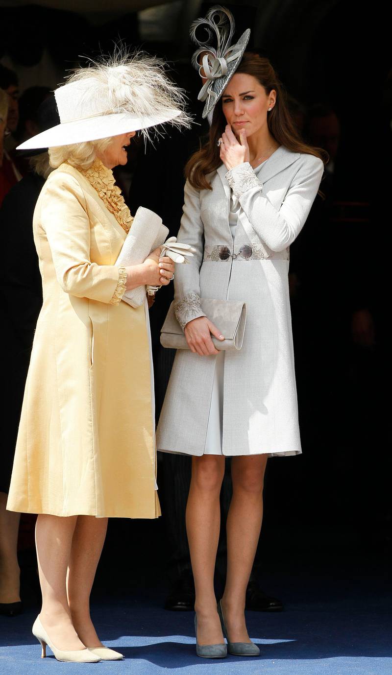 WINDSOR, ENGLAND - JUNE 13:   Camilla, Duchess of Cornwall (L) and Catherine, Duchess of Cambridge watch the Garter Service pass by on June 13, 2011 in Windsor, England. The Order of the Garter is the senior and oldest British Order of Chivalry, founded by Edward III in 1348. Membership in the order is limited to the sovereign, the Prince of Wales, and no more than twenty-four members. (Photo by Kirsty Wigglesworth/WPA Pool/ Getty Imagesl)