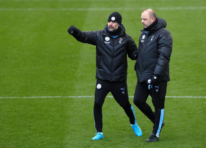 Manchester City manager Pep Guardiola, right, and assistant coach Rodolfo Borrell. Reuters