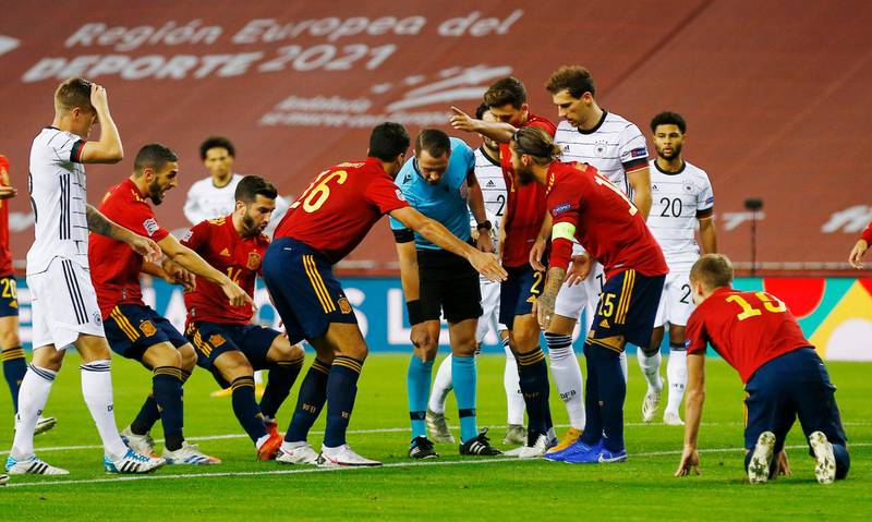 Spain's Sergio Ramos and Rodri remonstrate with the referee. Reuters