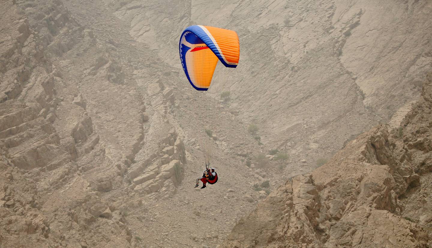 Abu Dhabi - July 4th  ,  2008 -The Nationals Reporter Karen Attwood paraglides through the Mountains of Musandam , Oman,  to  check into  the Six Senses Hideaway Zighy Bay resort Hotel . ( Andrew Parsons  /  The National )
FOR ARTS AND LIFE TRAVEL  SECTION *** Local Caption ***  ap002-1207-6 senses hideaway.jpgal17oman1.jpg