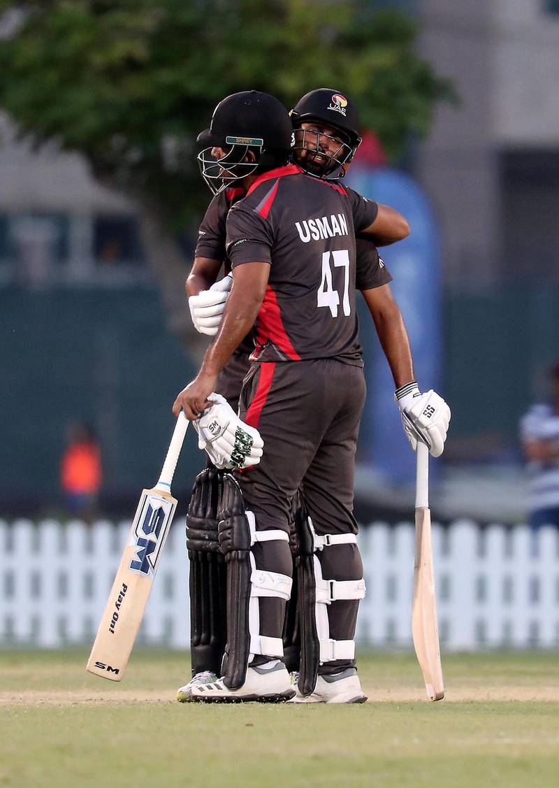 DUBAI, UNITED ARAB EMIRATES , Dec 15– 2019 :- Basil Hameed and Muhammad Usman of UAE celebrating after winning the match against Scotland during the World Cup League 2 cricket match between UAE vs Scotland held at ICC academy in Dubai. UAE won the match by 7 wickets. ( Pawan Singh / The National )  For Sports. Story by Paul