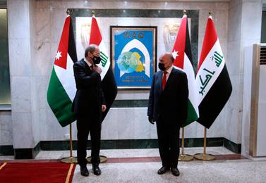 Iraqi Foreign Minister Fuad Hussein met Jordanian counterpart Ayman Safadi  in Baghdad on Wednesday. AP